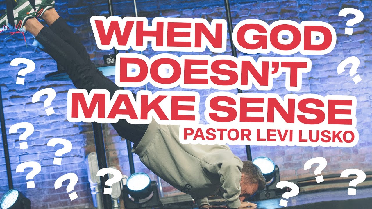 Levi Lusko does a handstand on a stage while preaching at fresh life