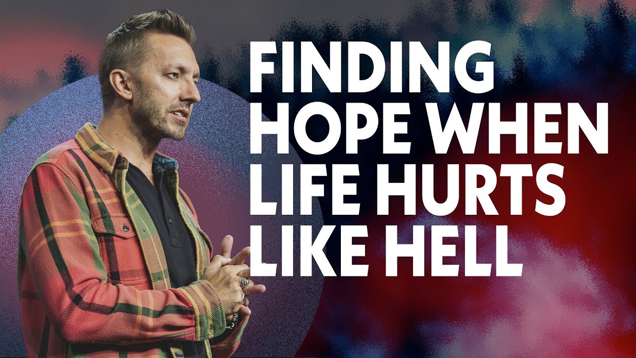 Pastor Levi Lusko standing and looking forward with his hands in front of him clasped.