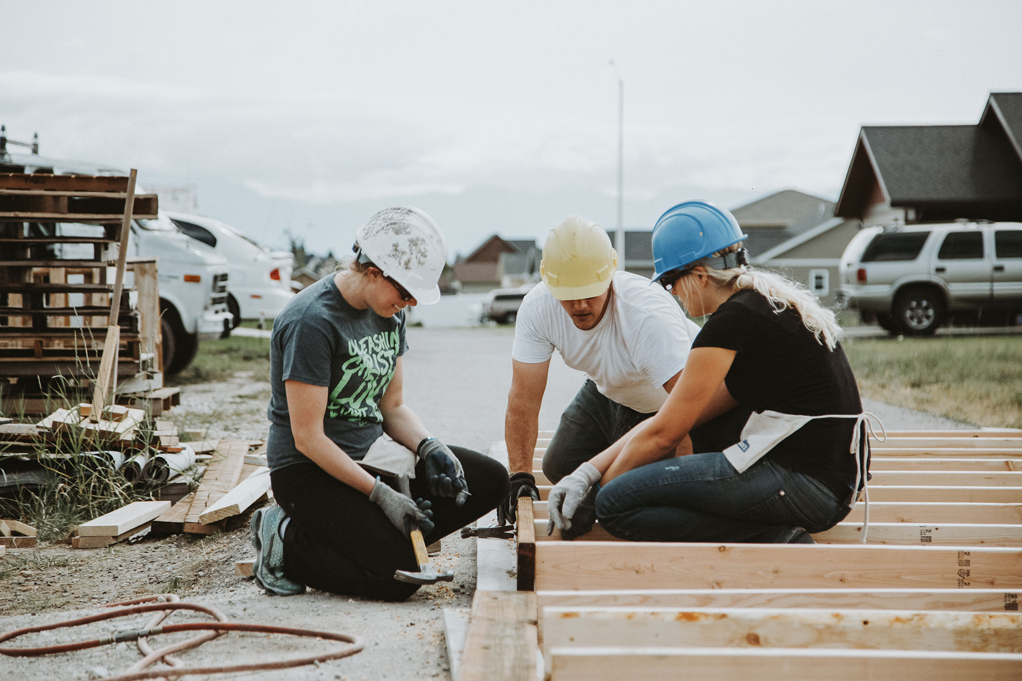 A few people working on a volunteer construction project